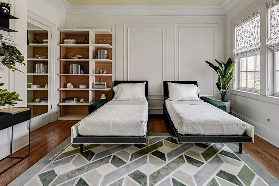 Two single wall beds open over sofa seats