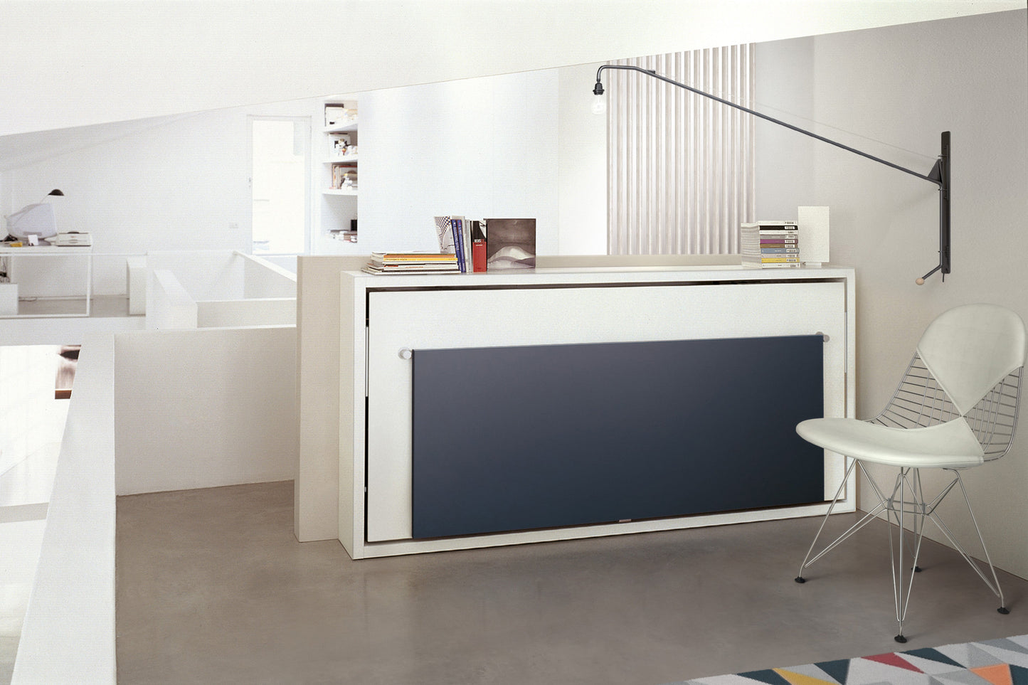 Wall bed with desk fixed to front, saving space