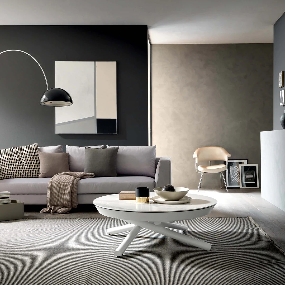 Transforming coffee-to-dining table in living room setting