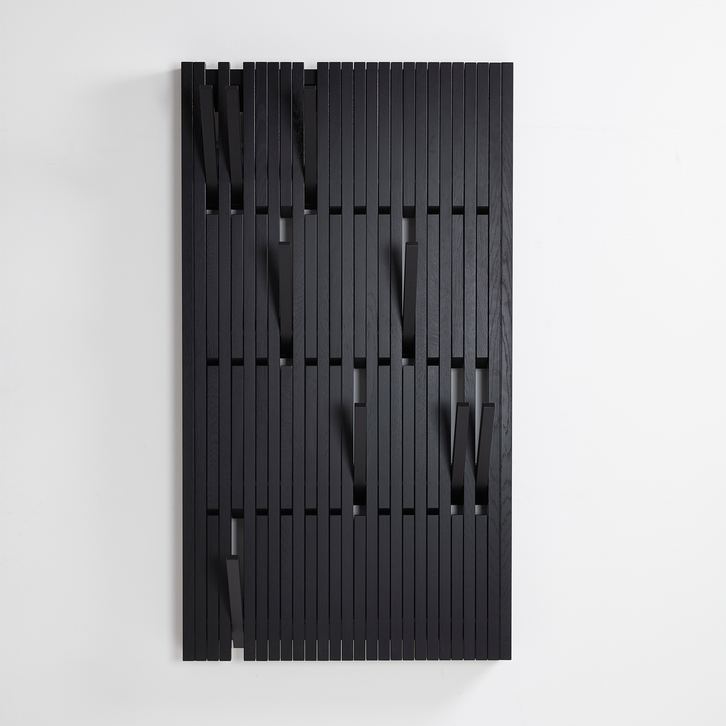 Wooden wall hanger for hallways finished in black.