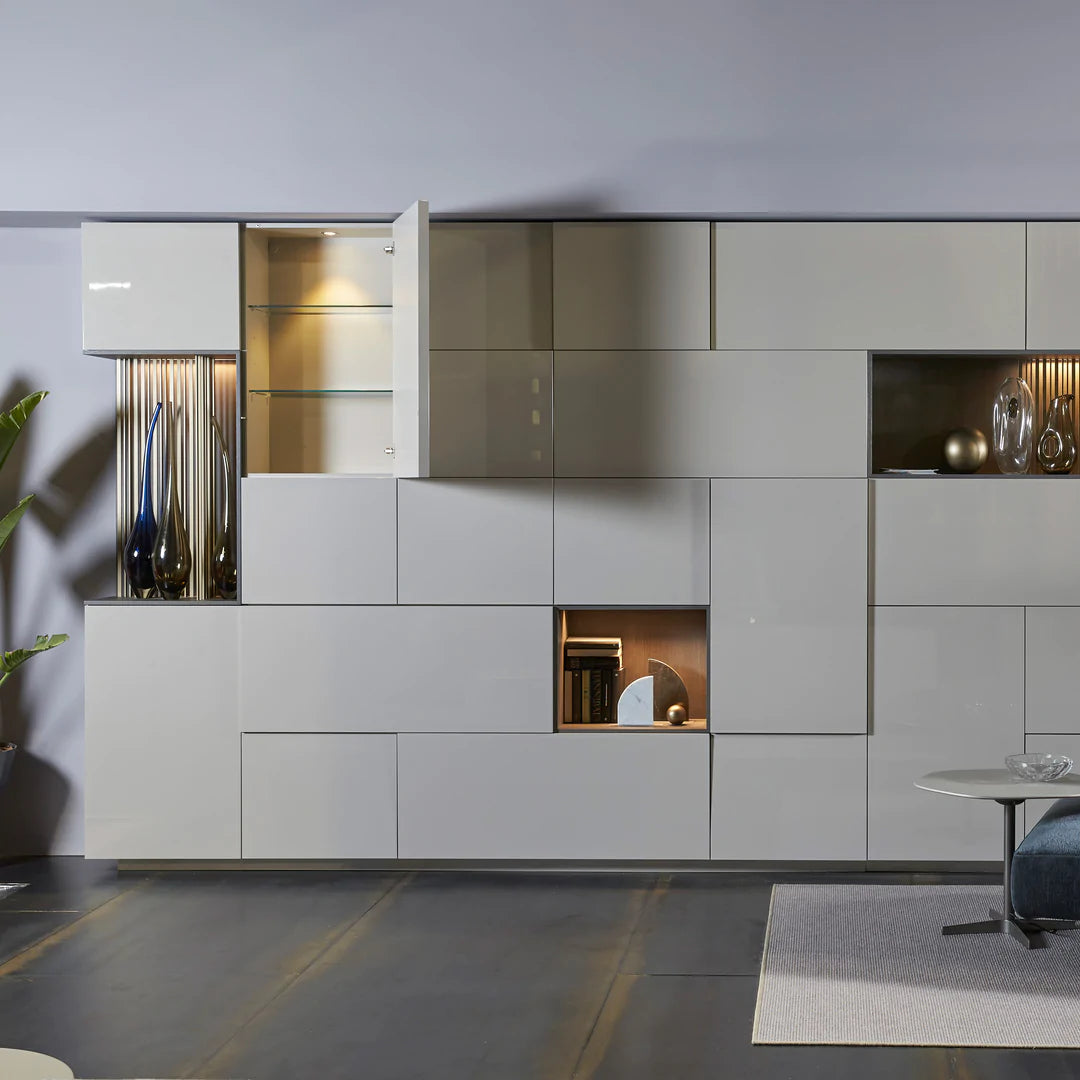 Wall to wall custom cabinetry, including hidden desk, bar, and shelving.
