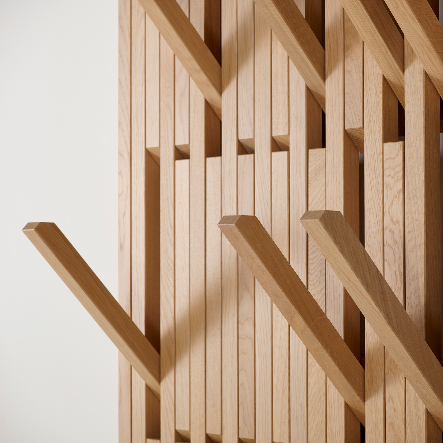 Close up of arms on beechwood wall hanger.