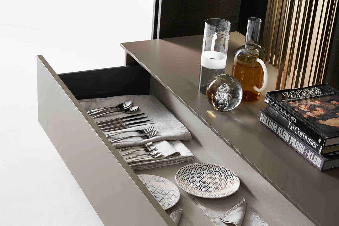 Open storage drawers on freestanding media unit.