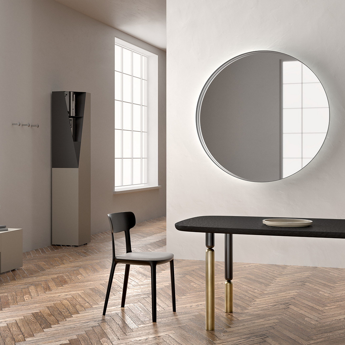 Circular wall mirror above dining table.