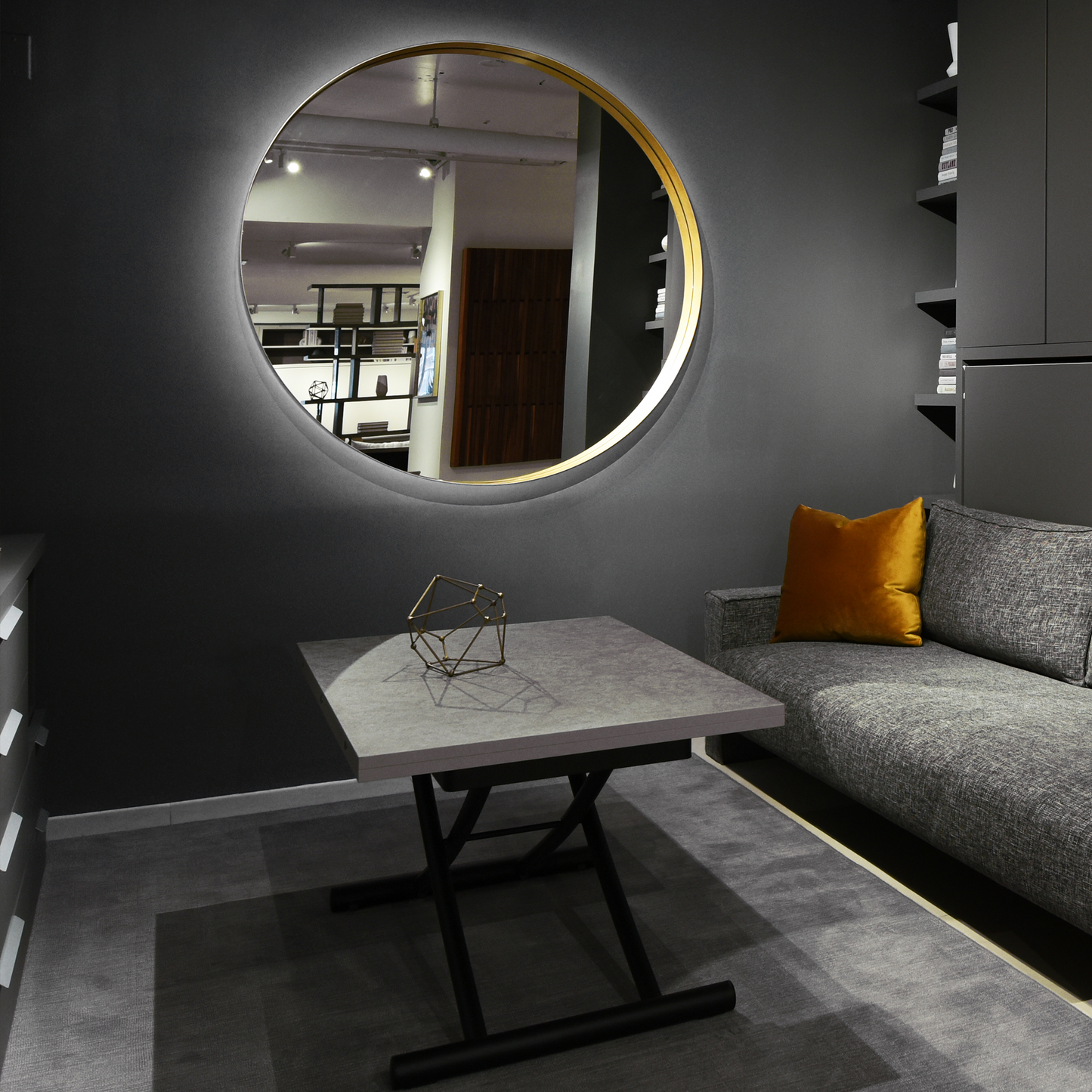 Gold circular wall mirror in living room.