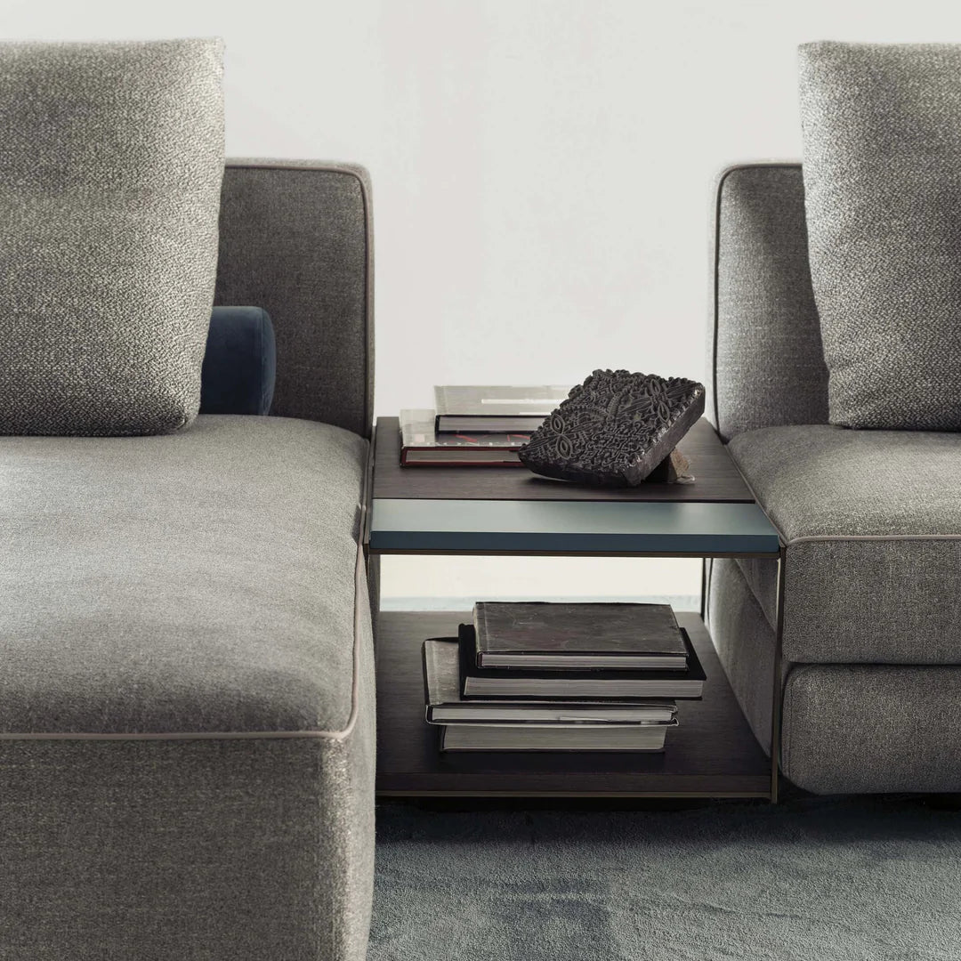 Close up of coffee table separating two pieces of Glam modular sofa.