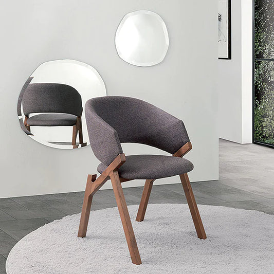 Byron dining chair with walnut frame and upholstered seat.