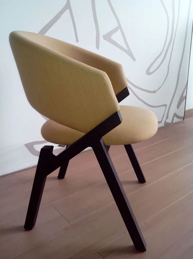 Byron dining chair with tobacco frame and upholstered seat.