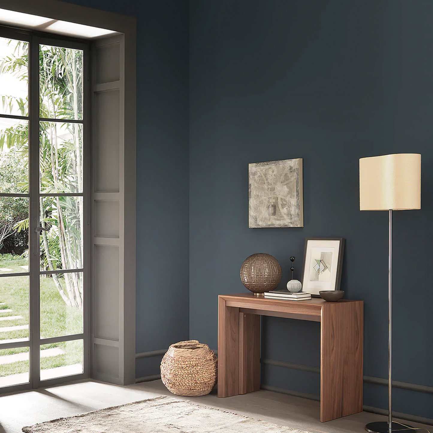 Wooden console table flush against wall.