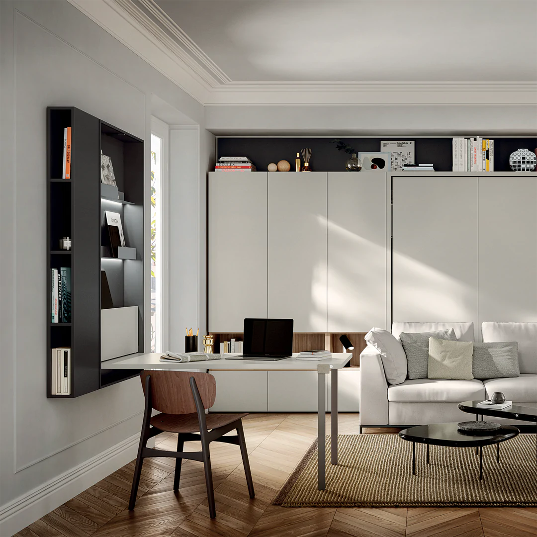 Living area with Wally desk open, showing integrated shelves in the wall-mounted unit.