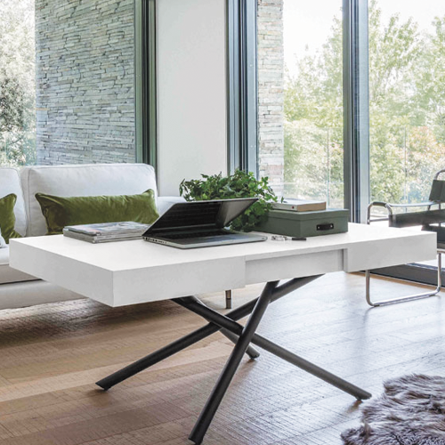 Coffee table extended with laptop on table top