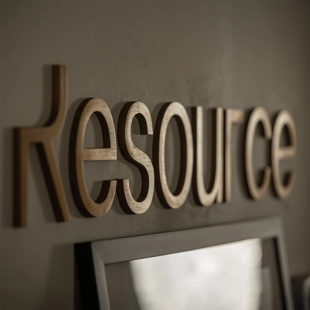 Close up of the Resource logo in a showroom