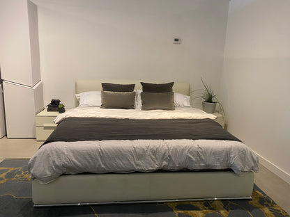 Queen sized bed with nightstands each side