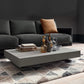 Height adjusting, expanding table being used as coffee table.