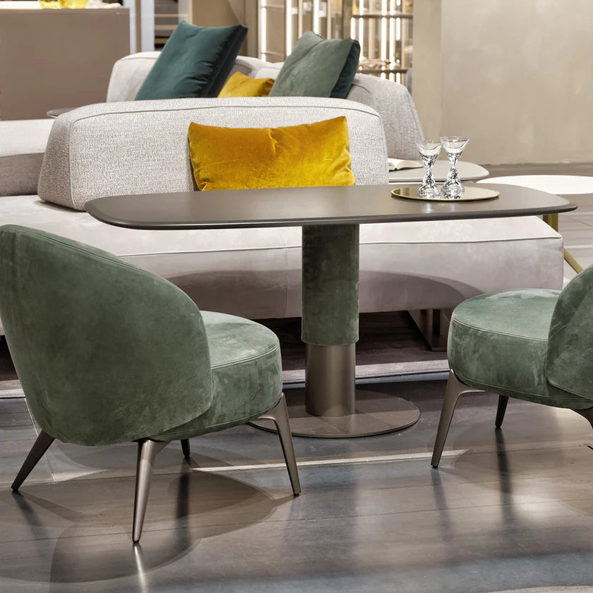 Dynamic height adjustable table set up with sofa and dining chairs.