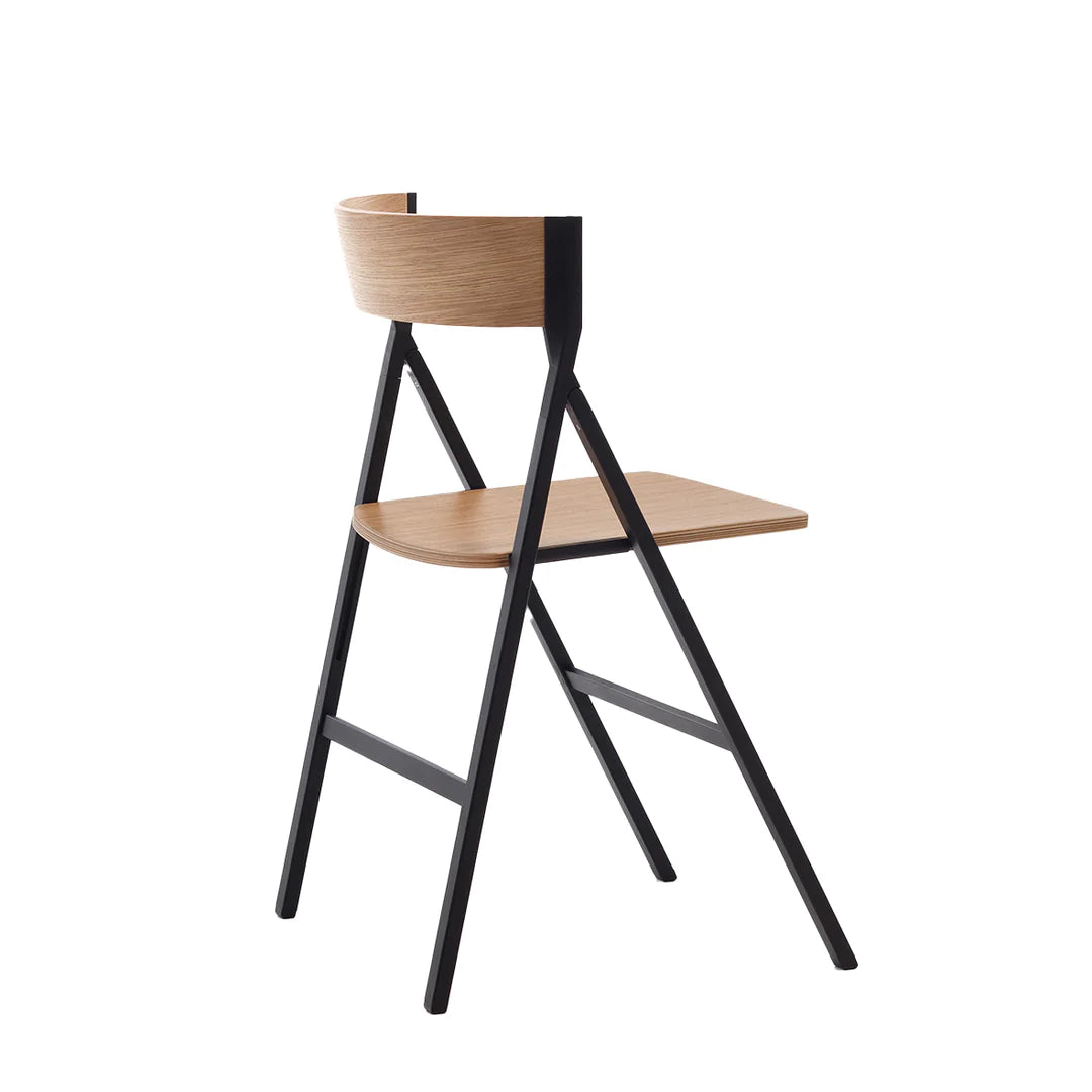 Folding dining chair with curved back, wooden seat and metal frame.