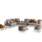 Byron sectional with complementing armchairs, white background.
