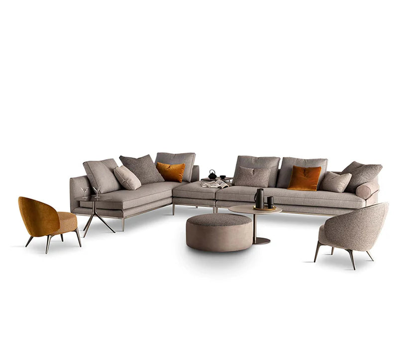 Byron sectional with complementing armchairs, white background.