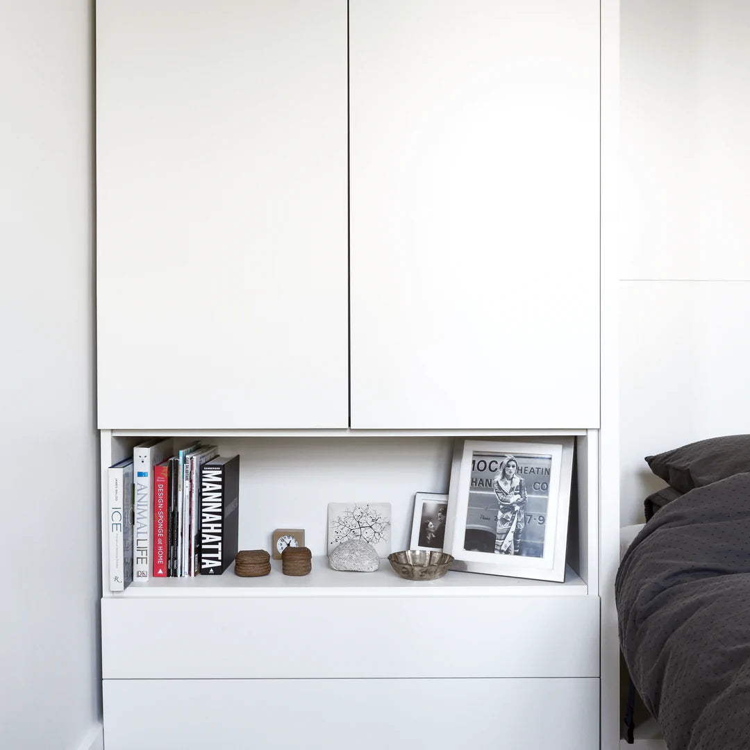 Double door cabinet with cubby and drawers.