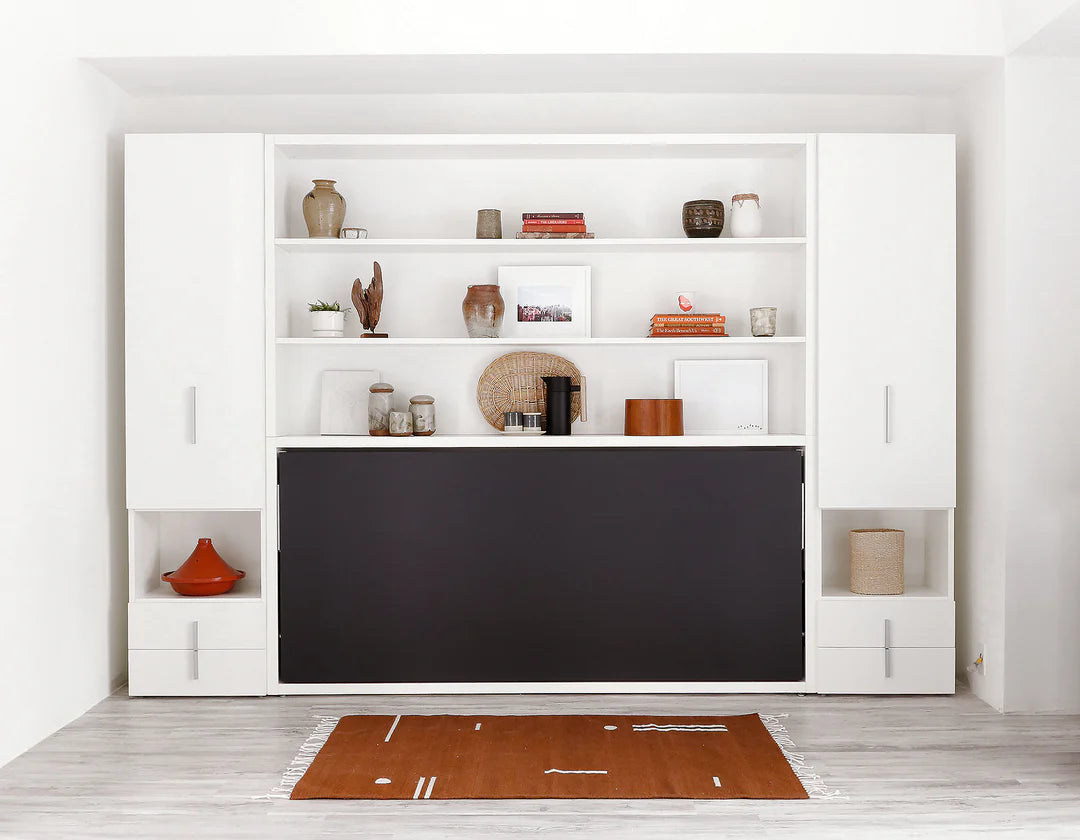 Single cabinets with cubby and drawers, each side of a wall bed.