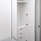 Single closet with hanging bar and built in drawers.