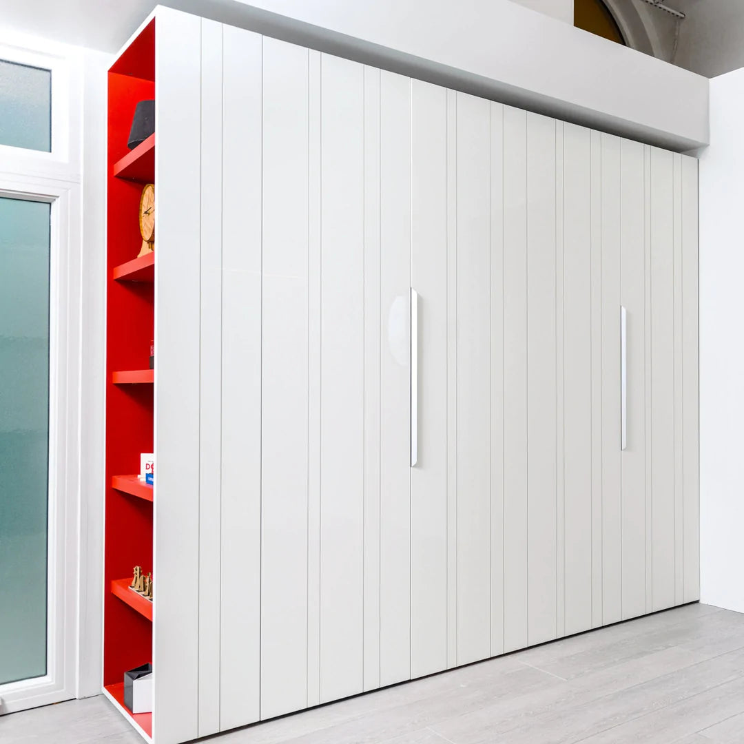 Wall to wall closets with doors and shelving.