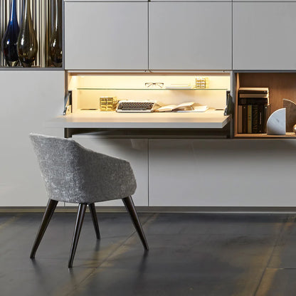 Hidden desk built in to custom cabinetry.