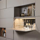 Hidden bar built in to custom cabinetry.