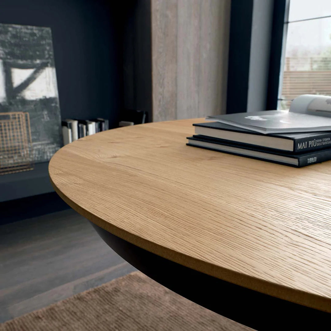 Wood finish table top on circular dining table.