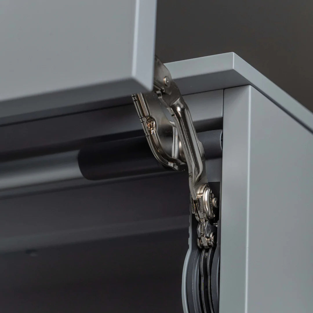 Close up of hinges on wall mounted desk.