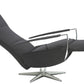 Leather recliner in relaxing position, backrest down and footrest up.