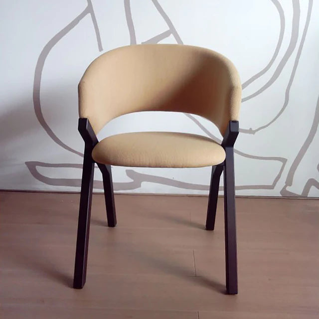 Byron dining chair with tobacco frame and upholstered seat.
