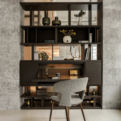 Shelving unit between two walls, acting as a room divider.