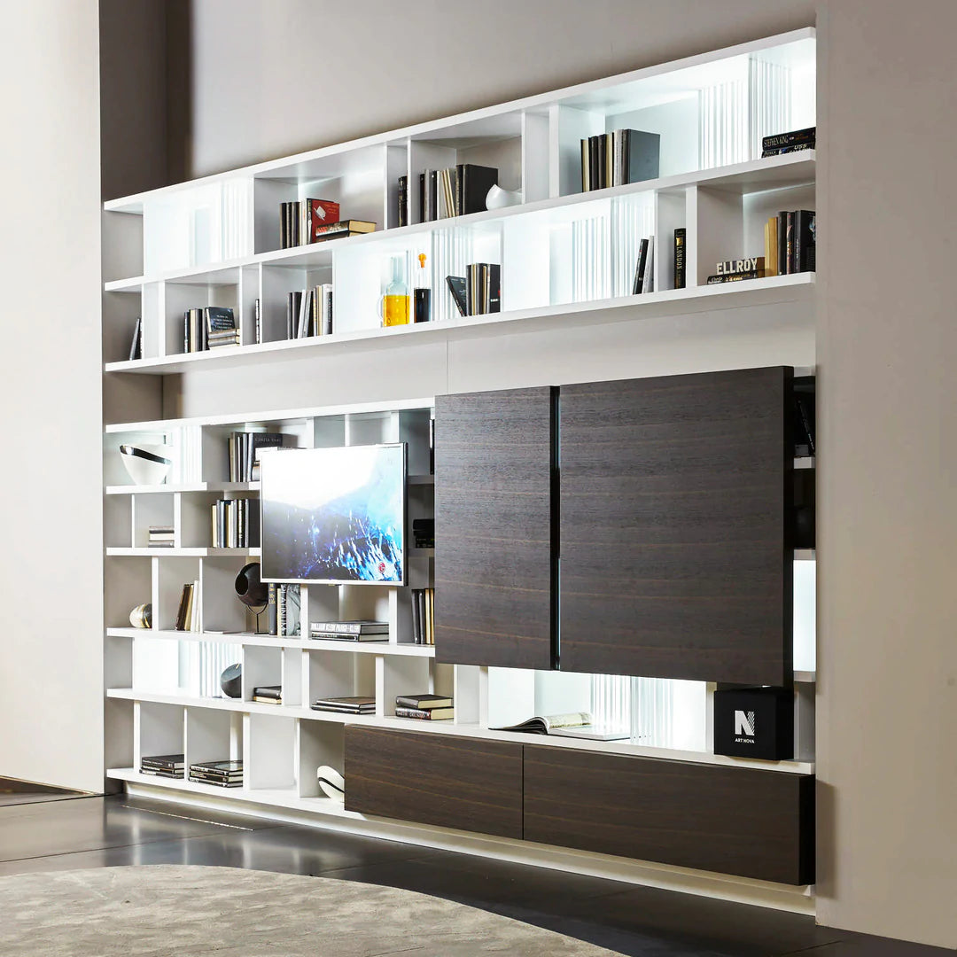 Wall to wall custom shelving unit with dividers and TV panel.