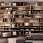 Floor to ceiling custom shelving unit with built in LED lighting.