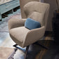 Cosy armchair with swivel base and upholstered seat.