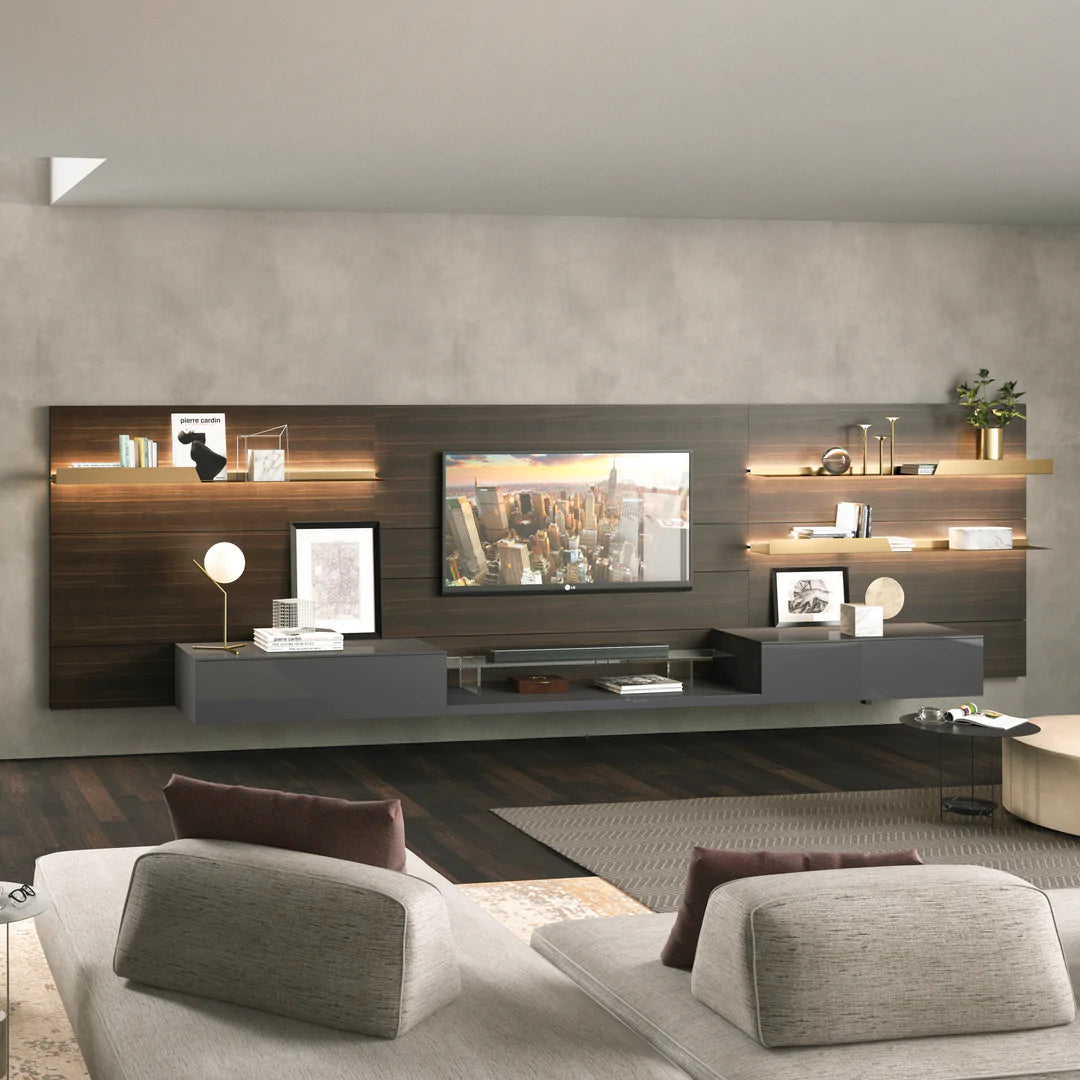Wall mounted media unit with chic shelving and TV display. Sofa sits facing the TV.