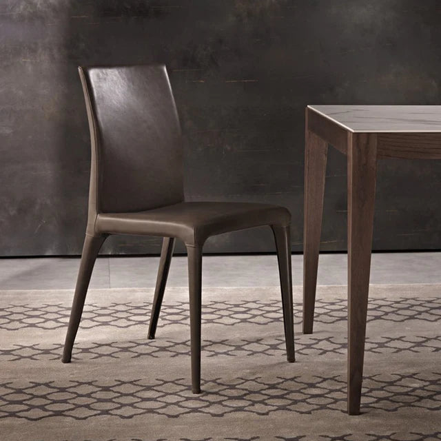Dining chair with seat and legs in leather.